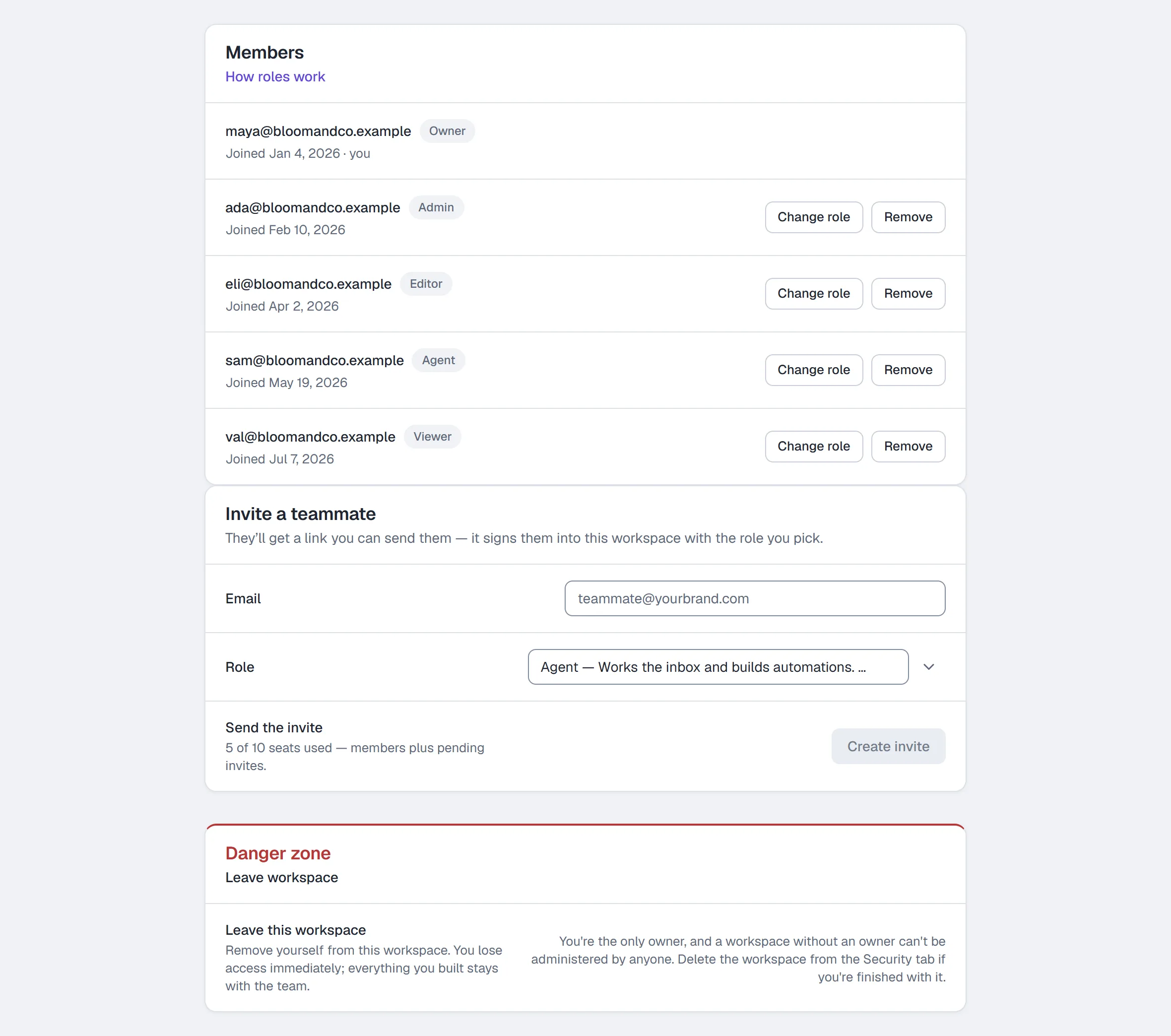 Settings → Team & roles — six roles on the members list, Change role on each row the owner may change